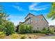 Well-maintained brick home with lush landscaping and manicured lawn at 1099 Heyward Way, Alpharetta, GA 30009