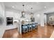 Bright kitchen with island and bar stool seating, pendant lights, and stainless steel appliances at 1099 Heyward Way, Alpharetta, GA 30009