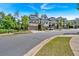 Street view of luxurious townhomes featuring well-maintained landscaping and convenient parking at 1099 Heyward Way, Alpharetta, GA 30009