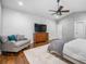 Spacious bedroom with hardwood floors, a ceiling fan, and natural light at 1375 Miller Reed Se Ave, Atlanta, GA 30315