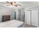 Primary bedroom featuring a ceiling fan, neutral walls, and double door closet at 1770 Rockland Se Dr, Atlanta, GA 30316