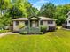Charming home with a welcoming front porch, lush green lawn, and tidy landscaping for great curb appeal at 1770 Rockland Se Dr, Atlanta, GA 30316