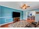 Bright and airy living room boasting chair rail, ceiling fan and seamless flow into the dining area at 1770 Rockland Se Dr, Atlanta, GA 30316