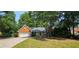 Charming brick home with attached garage and a well-maintained lawn at 2123 Condor Dr, Lawrenceville, GA 30044