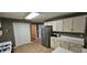 Bright kitchen with white cabinets and stainless steel refrigerator at 2123 Condor Dr, Lawrenceville, GA 30044