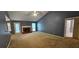 Spacious living room with fireplace and neutral carpet at 2123 Condor Dr, Lawrenceville, GA 30044
