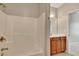 Bathroom featuring a shower and a vanity with storage cabinets and a marble countertop at 2384 Tree Arbor Way, Marietta, GA 30064