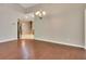 Open dining room with hardwood floors, chandelier, and easy access to kitchen at 2384 Tree Arbor Way, Marietta, GA 30064