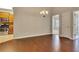 Bright dining room featuring hardwood floors, neutral walls, and modern chandelier lighting at 2384 Tree Arbor Way, Marietta, GA 30064