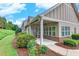 Charming home with covered porch, beautiful landscaping, and well-maintained lawn and walkway at 2384 Tree Arbor Way, Marietta, GA 30064