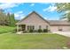 Inviting home exterior with a well-manicured lawn and a convenient three-car garage at 2384 Tree Arbor Way, Marietta, GA 30064