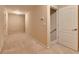 The hallway offers neutral carpeting, freshly painted walls, and stairs to the right at 2384 Tree Arbor Way, Marietta, GA 30064