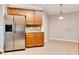Kitchen with stainless steel refrigerator, cabinets, and view into a dining area at 2384 Tree Arbor Way, Marietta, GA 30064