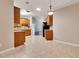 Bright kitchen and dining area with tile flooring, wooden cabinets, and stainless steel appliances at 2384 Tree Arbor Way, Marietta, GA 30064
