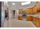 Spacious kitchen featuring stainless appliances, wooden cabinets, tile floors and granite countertops at 2384 Tree Arbor Way, Marietta, GA 30064