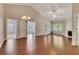 Expansive living space with hardwood floors, a fireplace, and open doorways to other rooms at 2384 Tree Arbor Way, Marietta, GA 30064