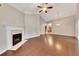 Open-concept living area boasts hardwood floors, fireplace, and a vaulted ceiling at 2384 Tree Arbor Way, Marietta, GA 30064