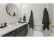 Elegant bathroom featuring a vanity with a sleek countertop and modern fixtures at 840 Hickory Sw Dr, Marietta, GA 30064