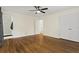 Comfortable bedroom with hardwood floors, closet space, and a ceiling fan at 840 Hickory Sw Dr, Marietta, GA 30064