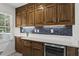 Charming kitchen with wooden cabinets, white countertops, and a convenient wine cooler at 840 Hickory Sw Dr, Marietta, GA 30064