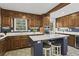 Stylish kitchen features custom cabinets, quartz countertops, stainless steel appliances, and a tile backsplash at 840 Hickory Sw Dr, Marietta, GA 30064