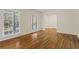 Spacious living room featuring beautiful hardwood floors, neutral paint, and a view to the entryway at 840 Hickory Sw Dr, Marietta, GA 30064