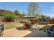 Backyard with a wooden deck, trampoline, picnic table, and landscaping at 2555 Blackstock Dr, Cumming, GA 30041