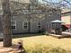 Spacious backyard featuring a patio, seating, and lush greenery, perfect for outdoor living at 2555 Blackstock Dr, Cumming, GA 30041