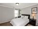 Bedroom with neutral walls, large window, and furniture set at 2555 Blackstock Dr, Cumming, GA 30041