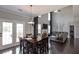 Open floor plan between kitchen and living room with tall ceilings and lots of natural light at 2555 Blackstock Dr, Cumming, GA 30041