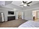 Large main bedroom offering a dresser, TV, and access to a bathroom at 2555 Blackstock Dr, Cumming, GA 30041
