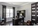 Office space with dark wood floors, large window with natural light, and built-in shelving at 2555 Blackstock Dr, Cumming, GA 30041
