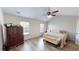 Bright bedroom with vaulted ceiling, wood-look floors, large windows and ample space for a relaxing retreat at 3325 Castleberry Village Cir, Cumming, GA 30040