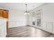 Dining room featuring a modern light fixture and access to the outside patio at 3325 Castleberry Village Cir, Cumming, GA 30040