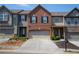 Charming townhome features brick accents, a two-car garage, and a well-maintained front yard in a desirable neighborhood at 3325 Castleberry Village Cir, Cumming, GA 30040
