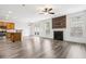 Open concept living room featuring an eat-in kitchen area, modern furniture, and neutral tones at 3325 Castleberry Village Cir, Cumming, GA 30040