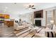Open concept living room featuring modern furniture, neutral tones, and an eat-in kitchen area at 3325 Castleberry Village Cir, Cumming, GA 30040