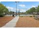 Community tennis courts with a black metal fence and fresh landscaping on a clear day at 3325 Castleberry Village Cir, Cumming, GA 30040