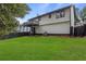 Beautiful backyard with a green lawn and a two-story home featuring a deck at 6322 Phillips Creek Dr, Lithonia, GA 30058