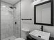 Modern bathroom with sleek black fixtures, elegant mirror, and stylish tiled shower at 6322 Phillips Creek Dr, Lithonia, GA 30058
