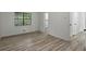 Bedroom with a large window providing view, access to a bathroom, and modern style at 6322 Phillips Creek Dr, Lithonia, GA 30058