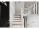 Bright entryway featuring a staircase with natural wood treads and white risers at 6322 Phillips Creek Dr, Lithonia, GA 30058