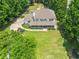 Aerial view of a home with a large yard, surrounded by lush greenery, offering privacy and space at 2820 Channing Way, Cumming, GA 30040