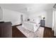 Serene bedroom featuring hardwood floors, a large bed, and contemporary decor at 2820 Channing Way, Cumming, GA 30040