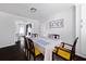Cozy dining room featuring a large table, modern decor, and hardwood floors at 2820 Channing Way, Cumming, GA 30040