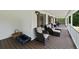 Cozy front porch furnished with comfortable seating, creating a relaxing outdoor living space at 2820 Channing Way, Cumming, GA 30040
