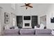 Bright and airy living room with a fireplace, built-in shelving, and comfortable seating, ideal for relaxation at 2820 Channing Way, Cumming, GA 30040
