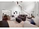 Bright living area with comfortable seating and open access to other rooms in the home at 2820 Channing Way, Cumming, GA 30040