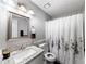 Bathroom with a vanity, granite countertop, and a shower with a curtain at 30 Court S, Ellenwood, GA 30294