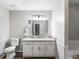 Bathroom with a granite countertop vanity, wood flooring, and a toilet at 30 Court S, Ellenwood, GA 30294